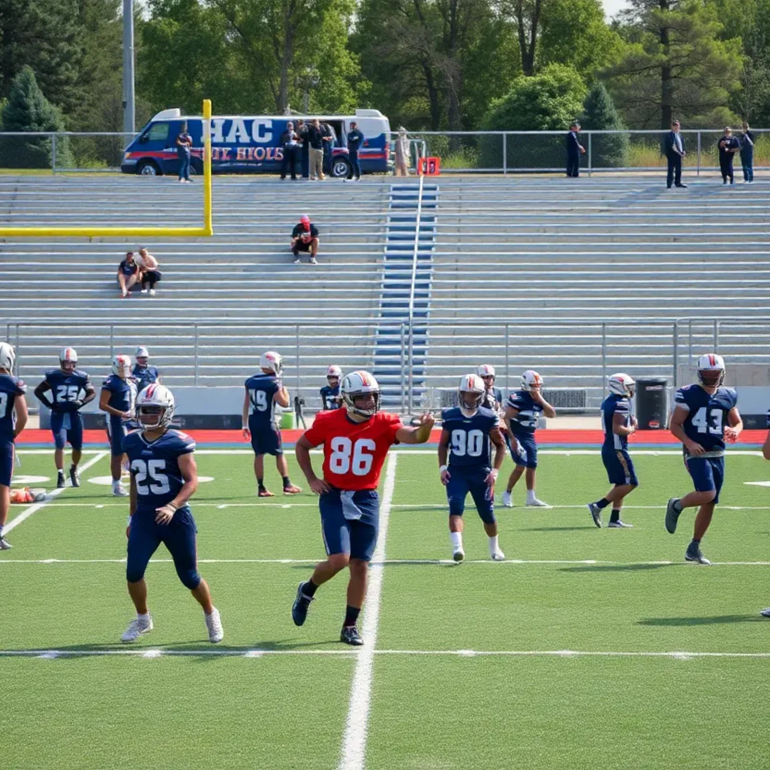 Football players practicing on a high school field